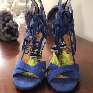 Sexy high heeled open toe blue suede shoes.